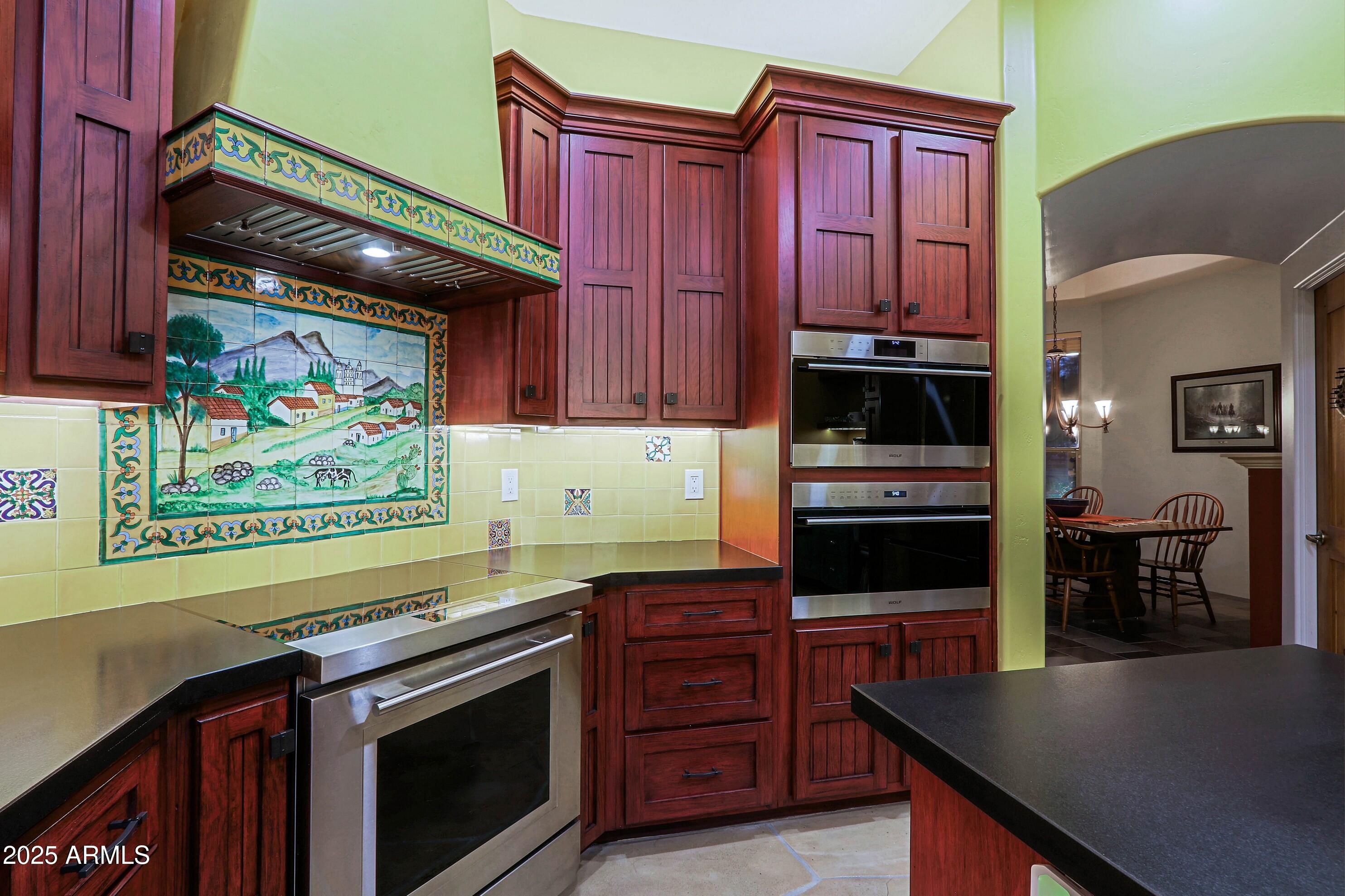 41840 North Spur Cross Road Cave Creek, AZ 85331 - Photo 18 of 67 a kitchen with stainless steel appliances granite countertop a stove and a microwave