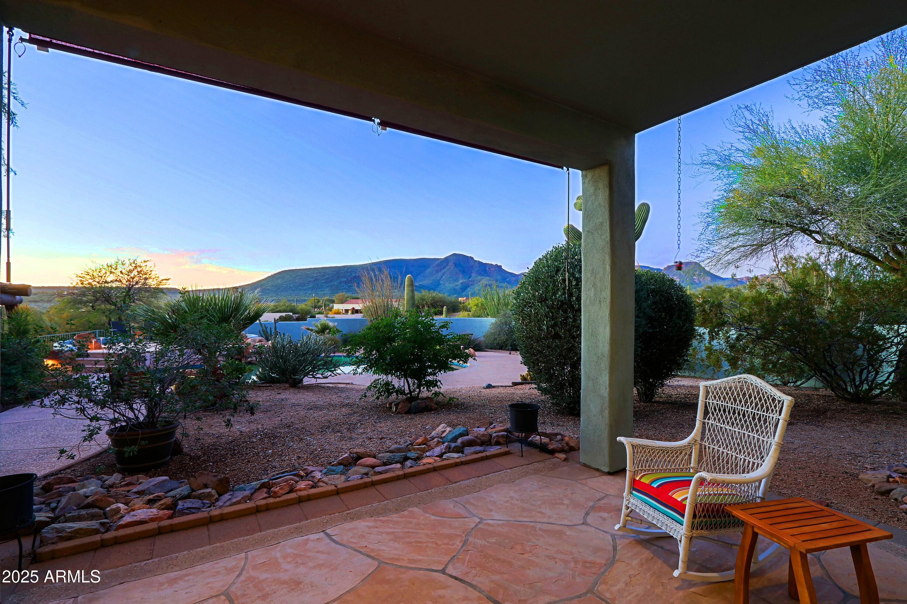 41840 North Spur Cross Road Cave Creek, AZ 85331 - Photo 28 of 67 a backyard of a house with table and chairs