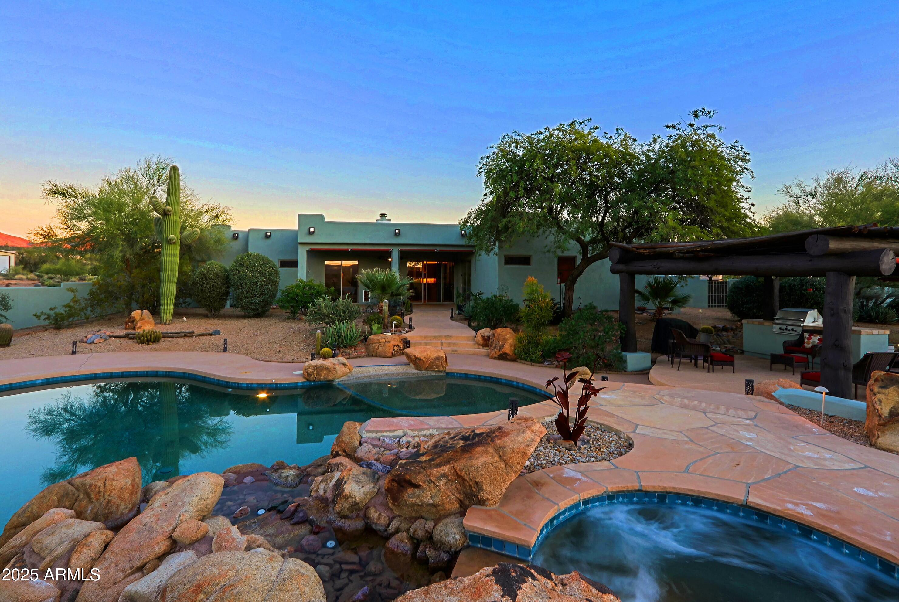 41840 North Spur Cross Road Cave Creek, AZ 85331 - Photo 38 of 67 a view of backyard with swimming pool and outdoor seating