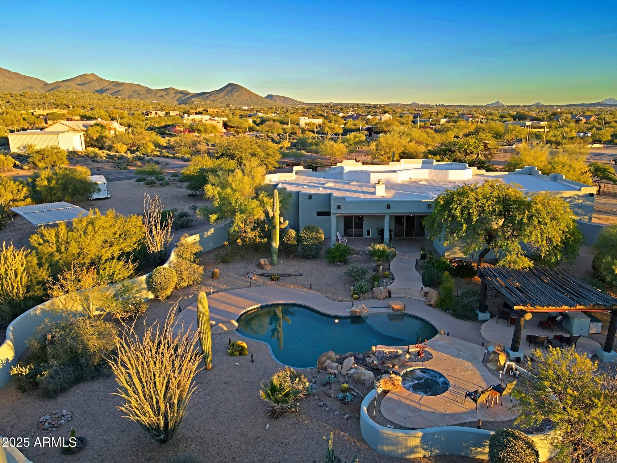 41840 North Spur Cross Road Cave Creek, AZ 85331 - Photo 43 of 67 an aerial view of a house with a swimming pool yard and outdoor seating