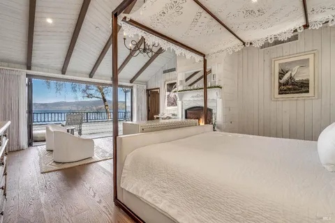 a view of a patio with table and chairs and potted plants