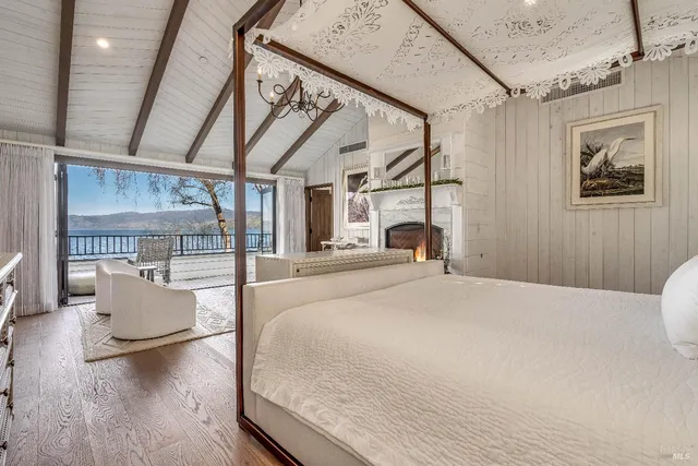a view of a patio with table and chairs and potted plants