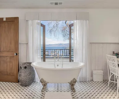 a living room with furniture a table tennis table and a fireplace