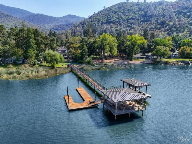 a kitchen with a dining table chairs and kitchen view