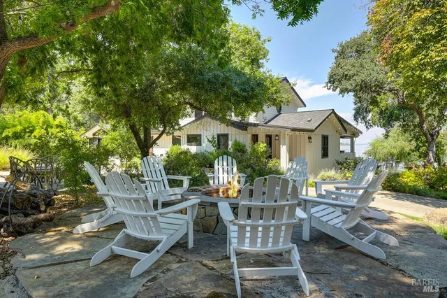 a view of a house with a yard and garden