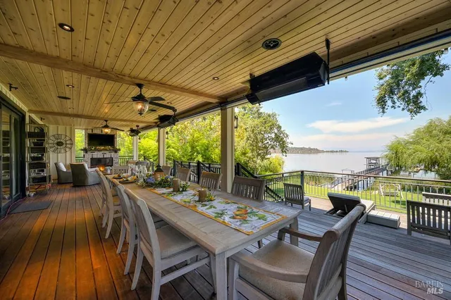 a view of a deck with two chairs and a table