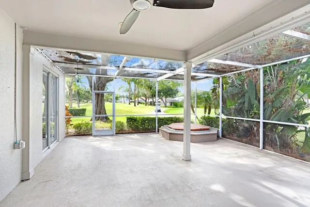 a view of a porch with furniture and garden