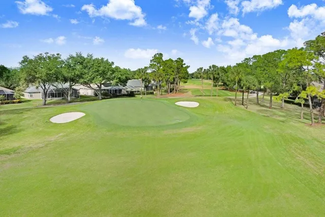 a view of a golf course with a lake