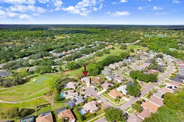 a view of a golf course with a big yard