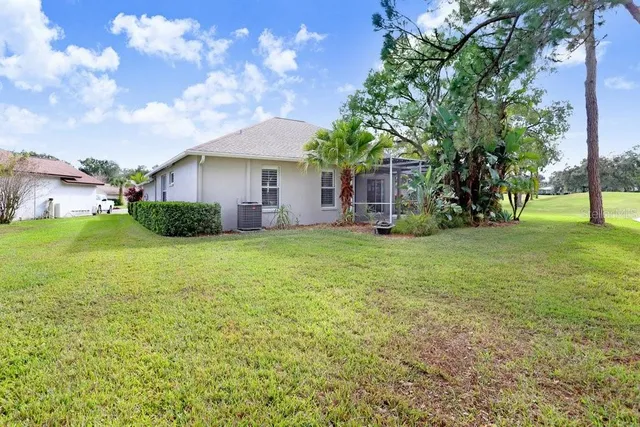 a view of a golf course with a house