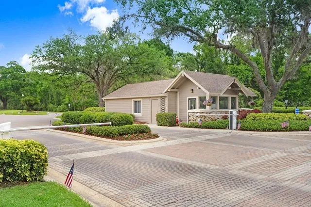 a front view of a house with a garden and porch
