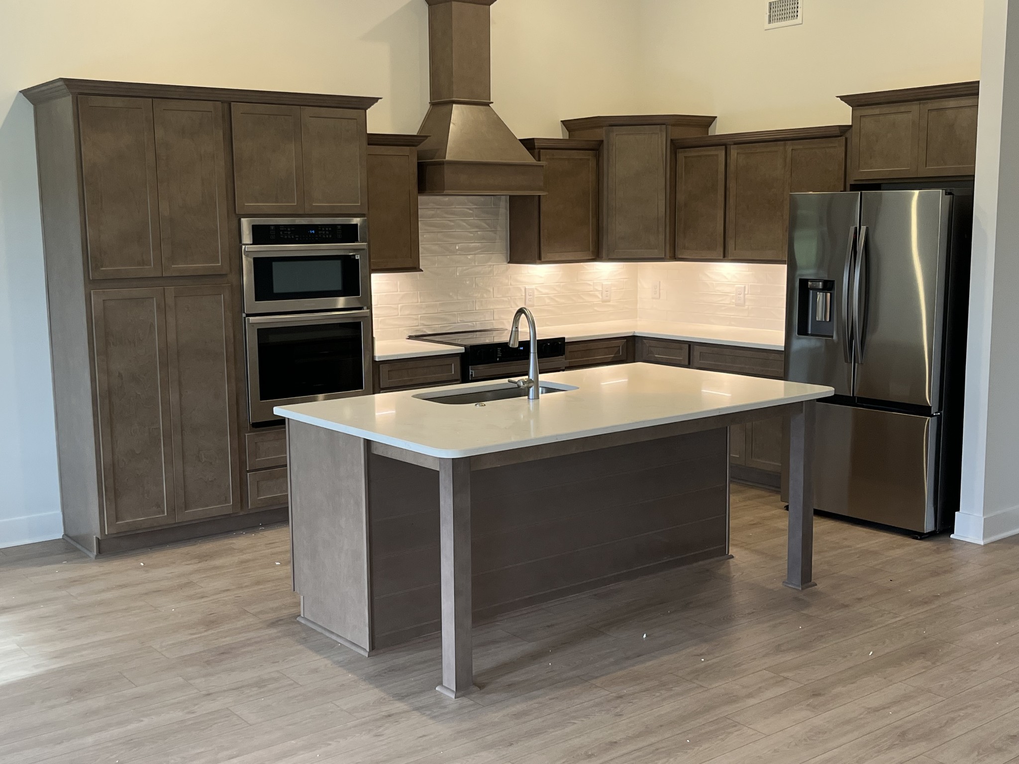 2629 Unitas Drive Murfreesboro, TN 37129 - Photo 6 of 20 a kitchen with kitchen island a counter top space cabinets and stainless steel appliances