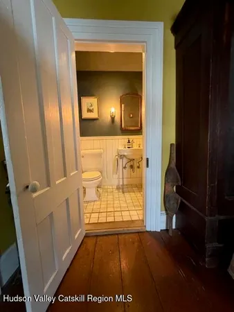 a bathroom with a sink a mirror and shower
