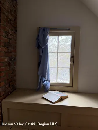 a bathroom with a bathtub and a window
