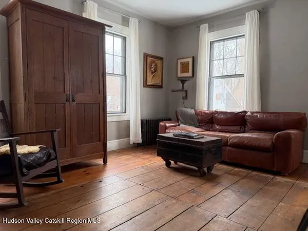 a living room with a couch and a window