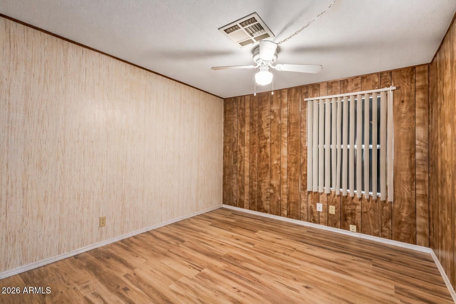 53 North Mountain Road, Unit 54 Apache Junction, AZ 85120 - Photo 23 of 35 Retro wood-paneled room with fan