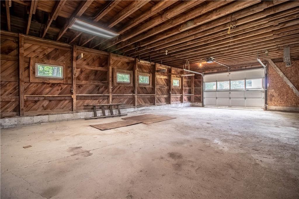 106 Robinson Hill Road Sebago, ME 04029 - Photo 34 of 34 HUGE garage~ with mechanics pit,...