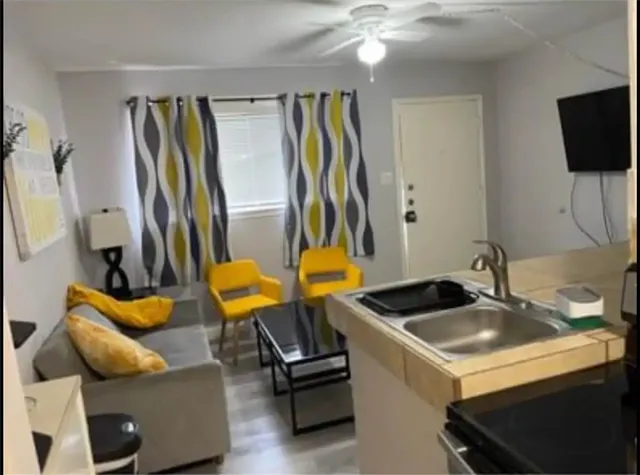 a room with furniture and a flat screen tv