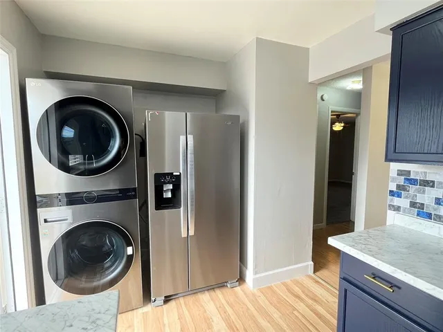 a view of a kitchen with a washer and dryer