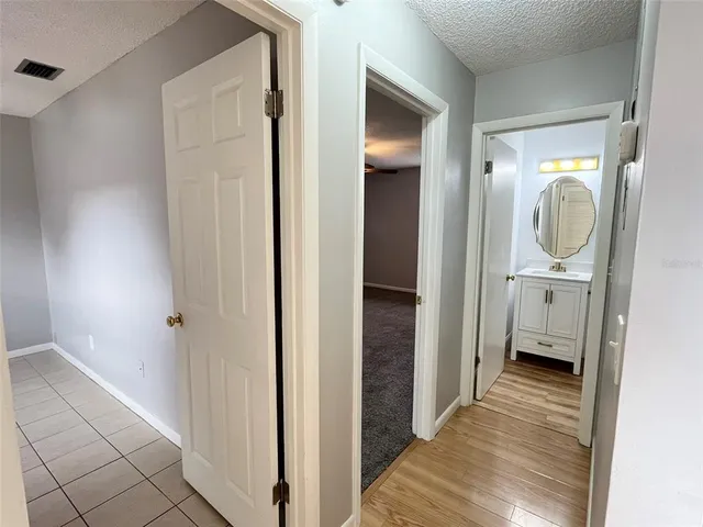 a view of a bathroom from a hallway
