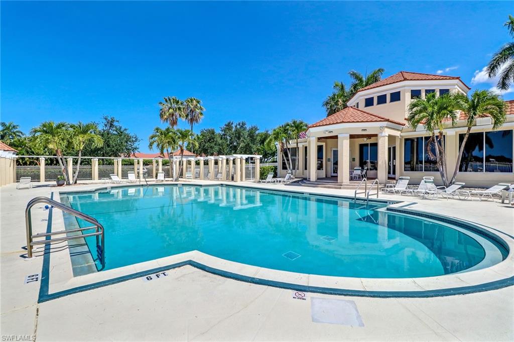 7791 Esmeralda Way, Unit L103 Naples, FL 34109 - Photo 1 of 46 a view of a house with pool and a yard