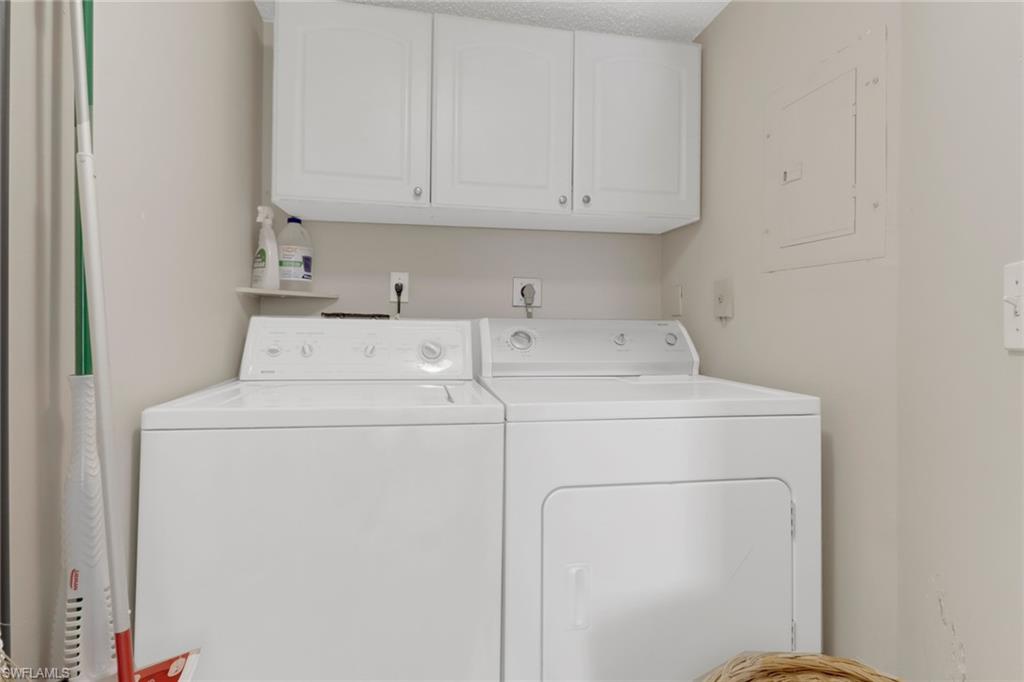 7791 Esmeralda Way, Unit L103 Naples, FL 34109 - Photo 25 of 46 a utility room with dryer and washer
