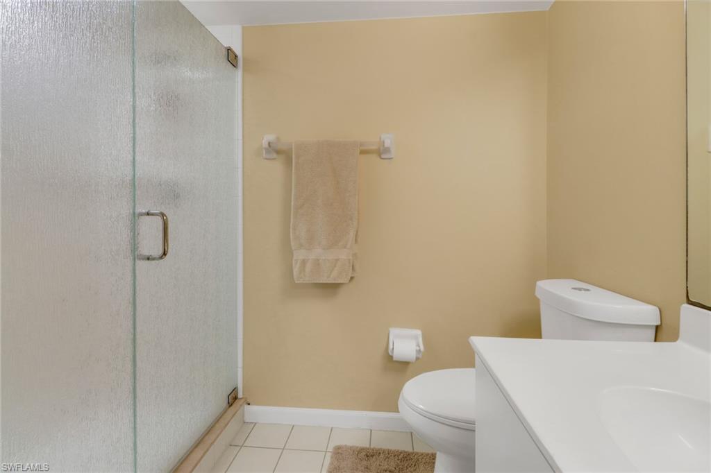 7791 Esmeralda Way, Unit L103 Naples, FL 34109 - Photo 26 of 46 a bathroom with a sink and toilet