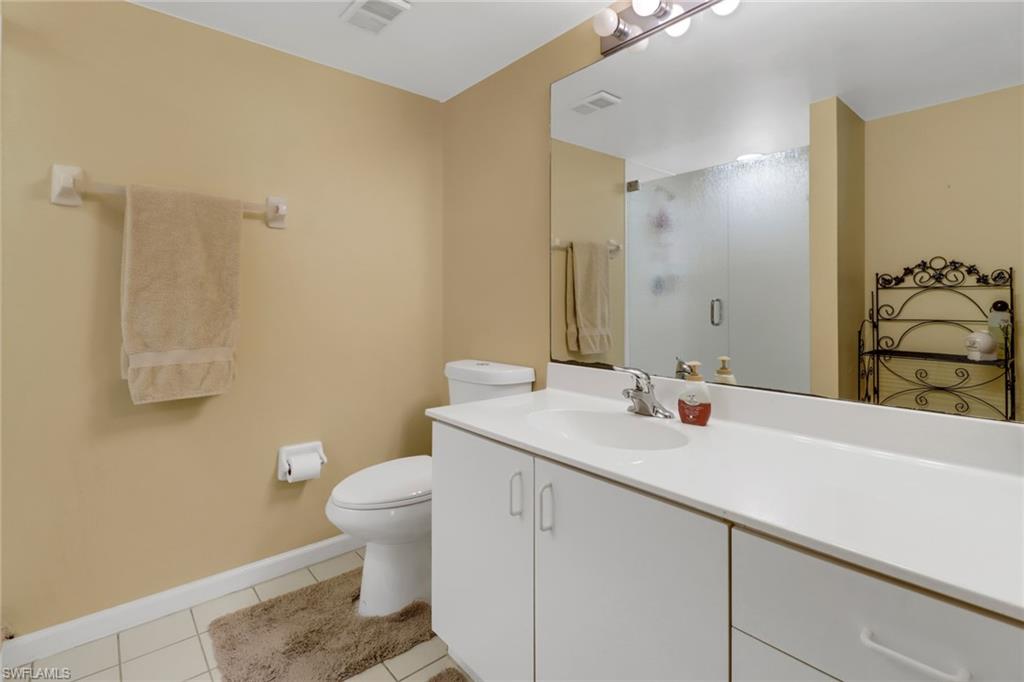 7791 Esmeralda Way, Unit L103 Naples, FL 34109 - Photo 27 of 46 a bathroom with a sink and a toilet