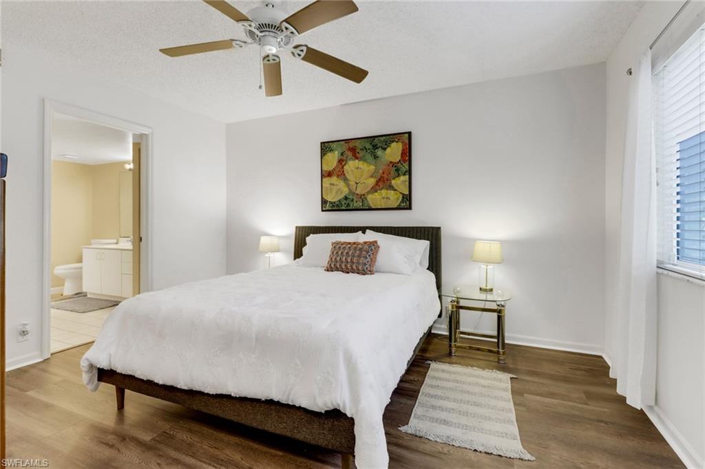 7791 Esmeralda Way, Unit L103 Naples, FL 34109 - Photo 28 of 46 a bedroom with a bed and window