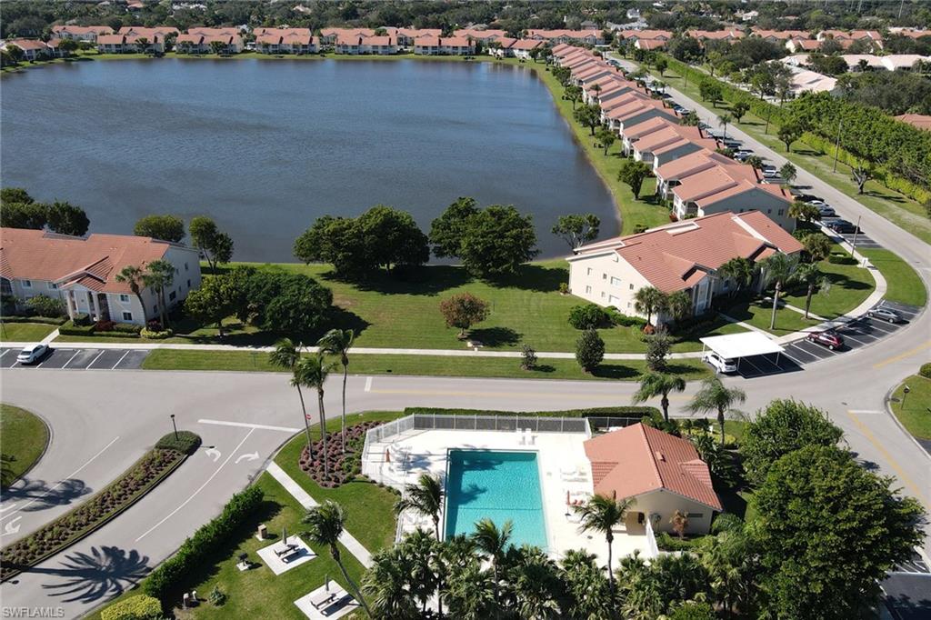 7791 Esmeralda Way, Unit L103 Naples, FL 34109 - Photo 33 of 46 an aerial view of house with yard swimming pool and outdoor seating