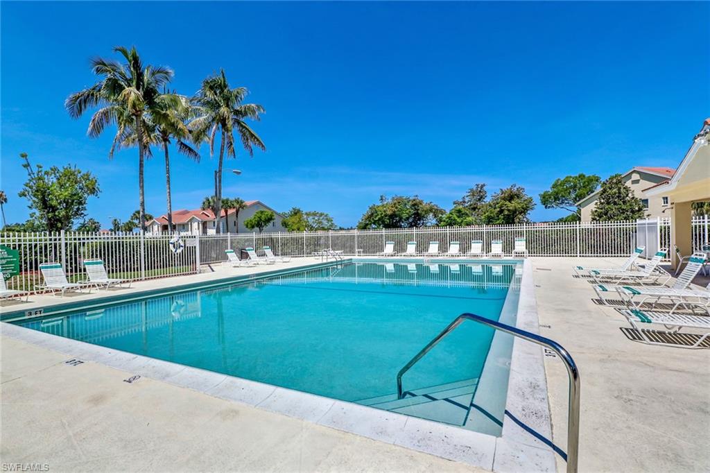 7791 Esmeralda Way, Unit L103 Naples, FL 34109 - Photo 40 of 46 a view of swimming pool with a lounge chair