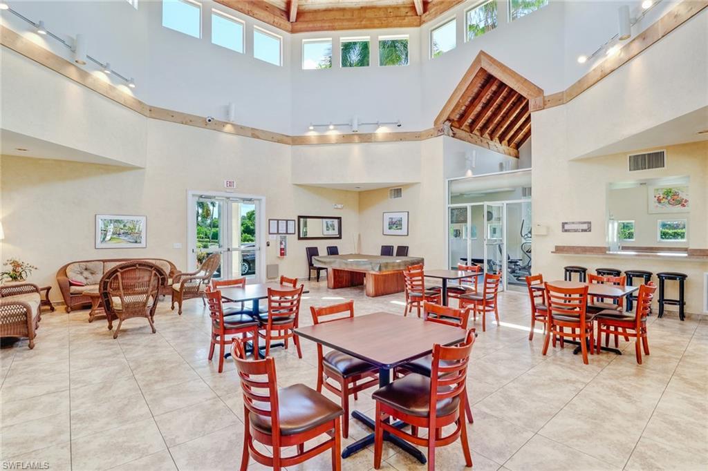 7791 Esmeralda Way, Unit L103 Naples, FL 34109 - Photo 43 of 46 a outdoor space with furniture and lots of furniture