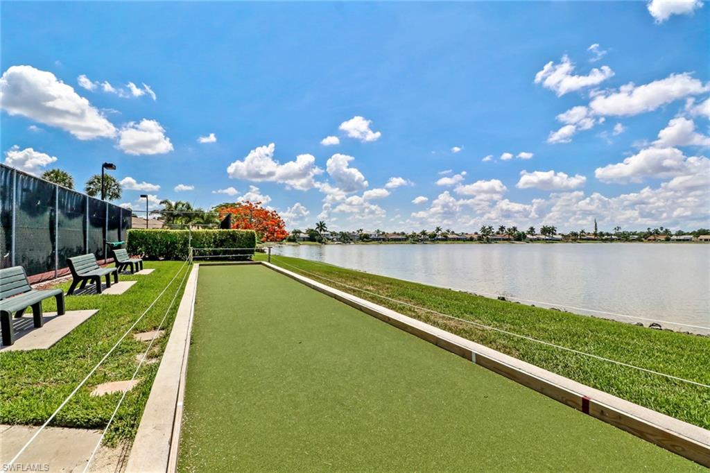 7791 Esmeralda Way, Unit L103 Naples, FL 34109 - Photo 46 of 46 a view of a lake with a big yard