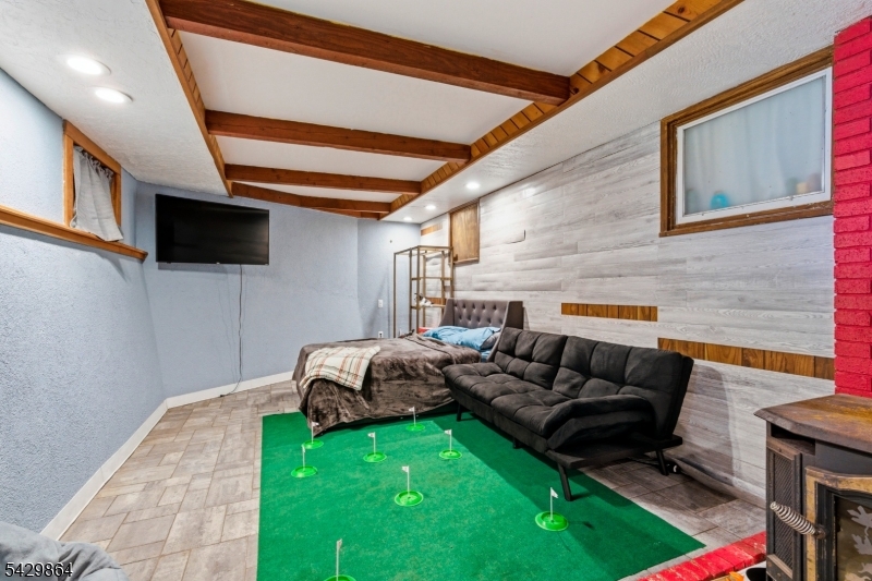 77 Lower North Shore Road Branchville, NJ 07826 - Photo 23 of 38 a living room with furniture and a flat screen tv