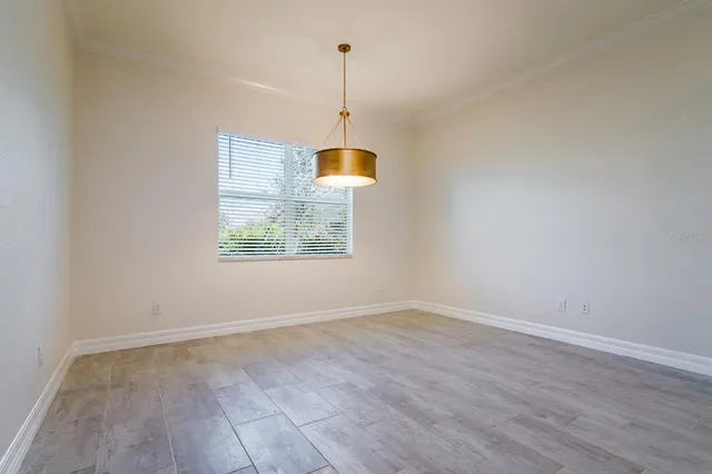 an empty room with windows and entrance