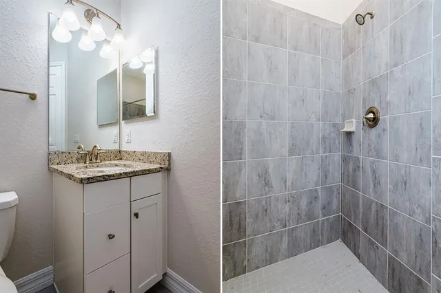 a bathroom with a sink a toilet and a mirror