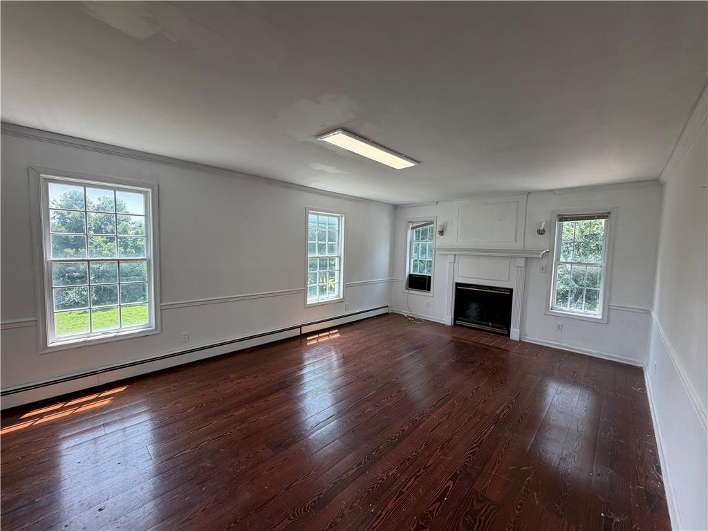 2552 Spring Street Coplay, PA 18037 - Photo 14 of 33 A traditional living room with rich wood floors and a classic fireplace.