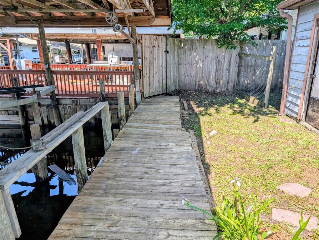 24514 Bonnet Road Astor, FL 32102 - Photo 13 of 37 a view of entryway with wooden floor