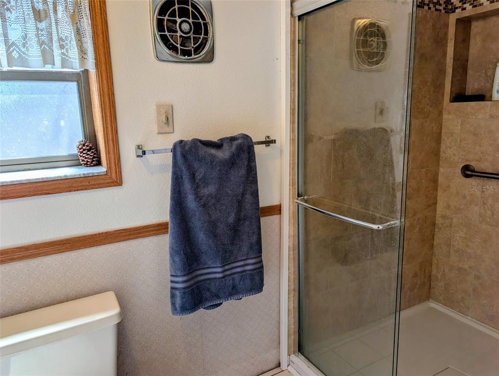 24514 Bonnet Road Astor, FL 32102 - Photo 29 of 37 a bathroom with a shower