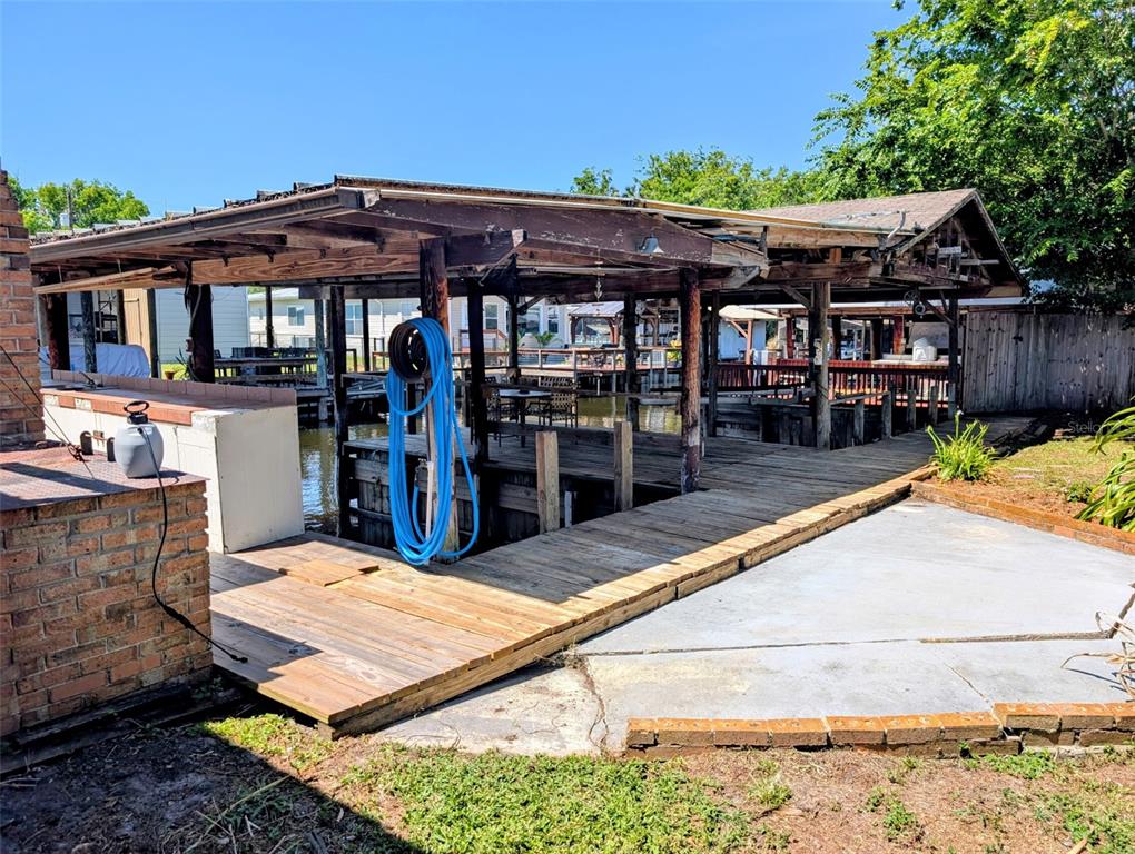 24514 Bonnet Road Astor, FL 32102 - Photo 36 of 37 a view of a dinning table and chairs in patio