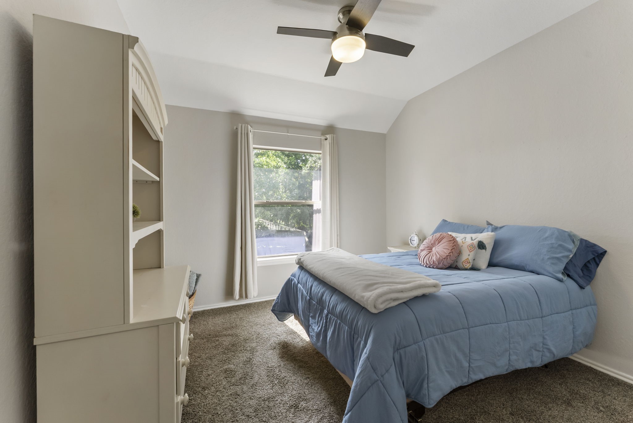 2106 Leaf Meadows Court Spring, TX 77386 - Photo 24 of 34 a bedroom with a bed and a window