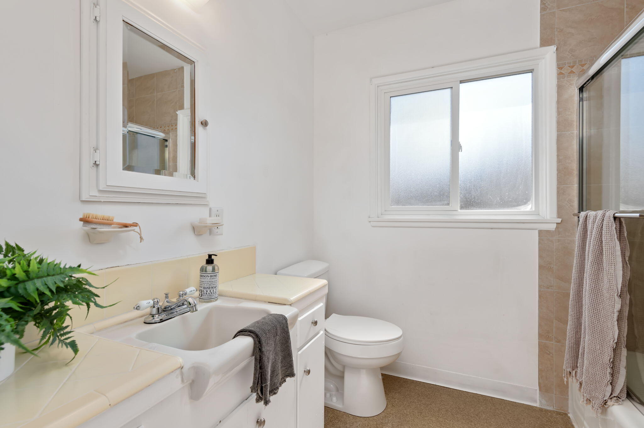 4612 Dean Drive Ventura, CA 93003 - Photo 23 of 33 a bathroom with a sink mirror and toilet