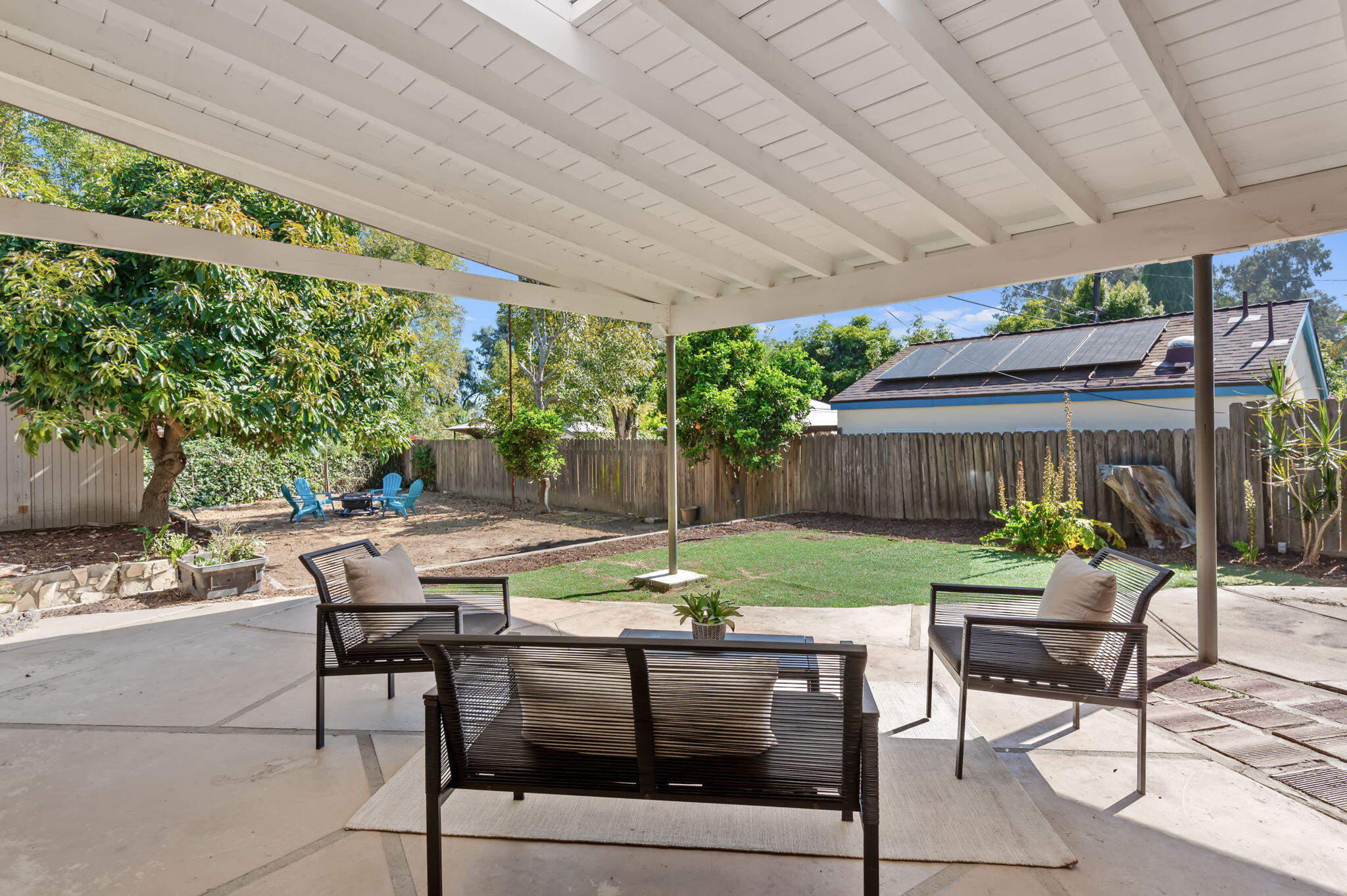4612 Dean Drive Ventura, CA 93003 - Photo 27 of 33 a view of a patio with a table chairs and a backyard
