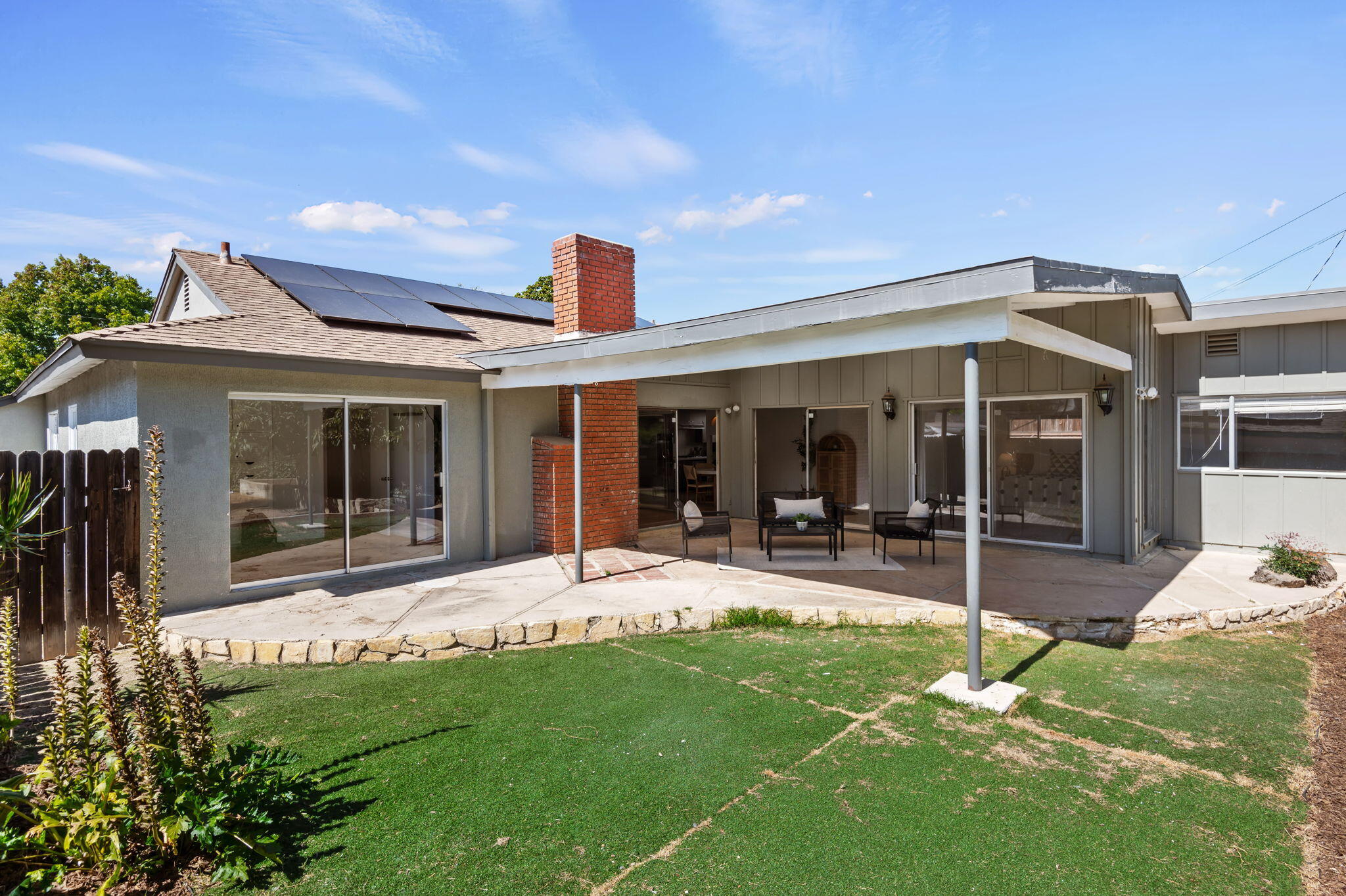 4612 Dean Drive Ventura, CA 93003 - Photo 29 of 33 a front view of a house with a garden and porch