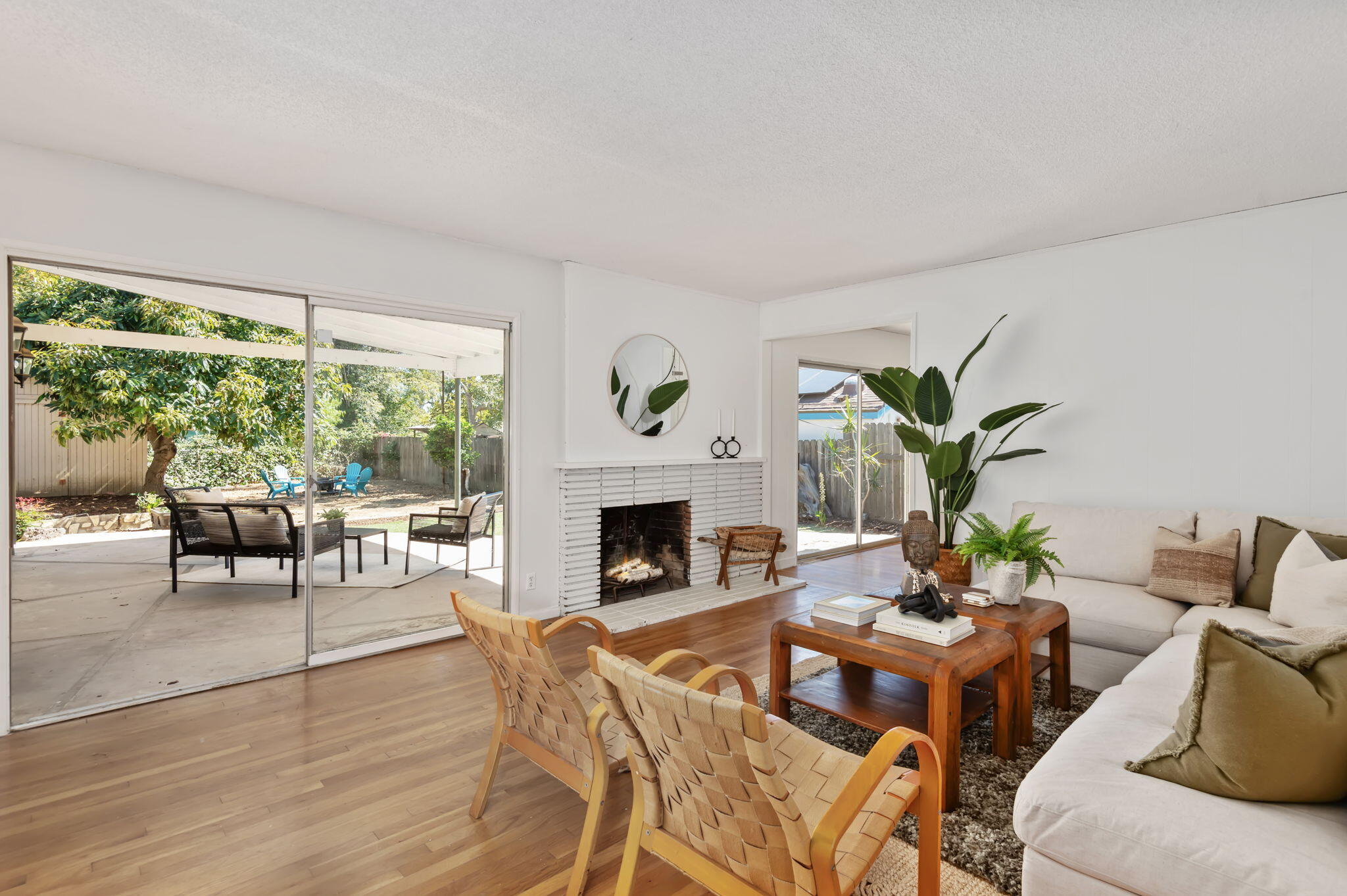 4612 Dean Drive Ventura, CA 93003 - Photo 4 of 33 a living room with furniture a fireplace and a potted plants
