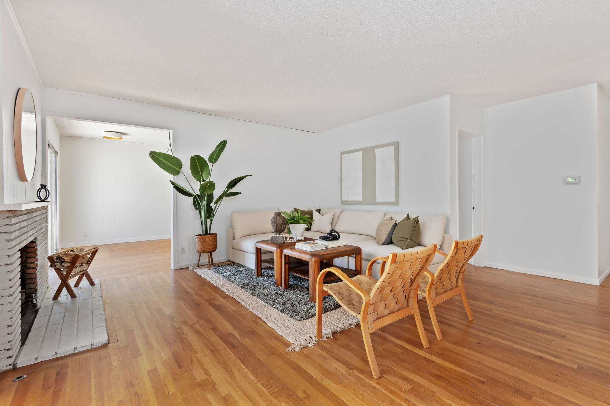 4612 Dean Drive Ventura, CA 93003 - Photo 5 of 33 a living room with furniture a wooden floor and a potted plant