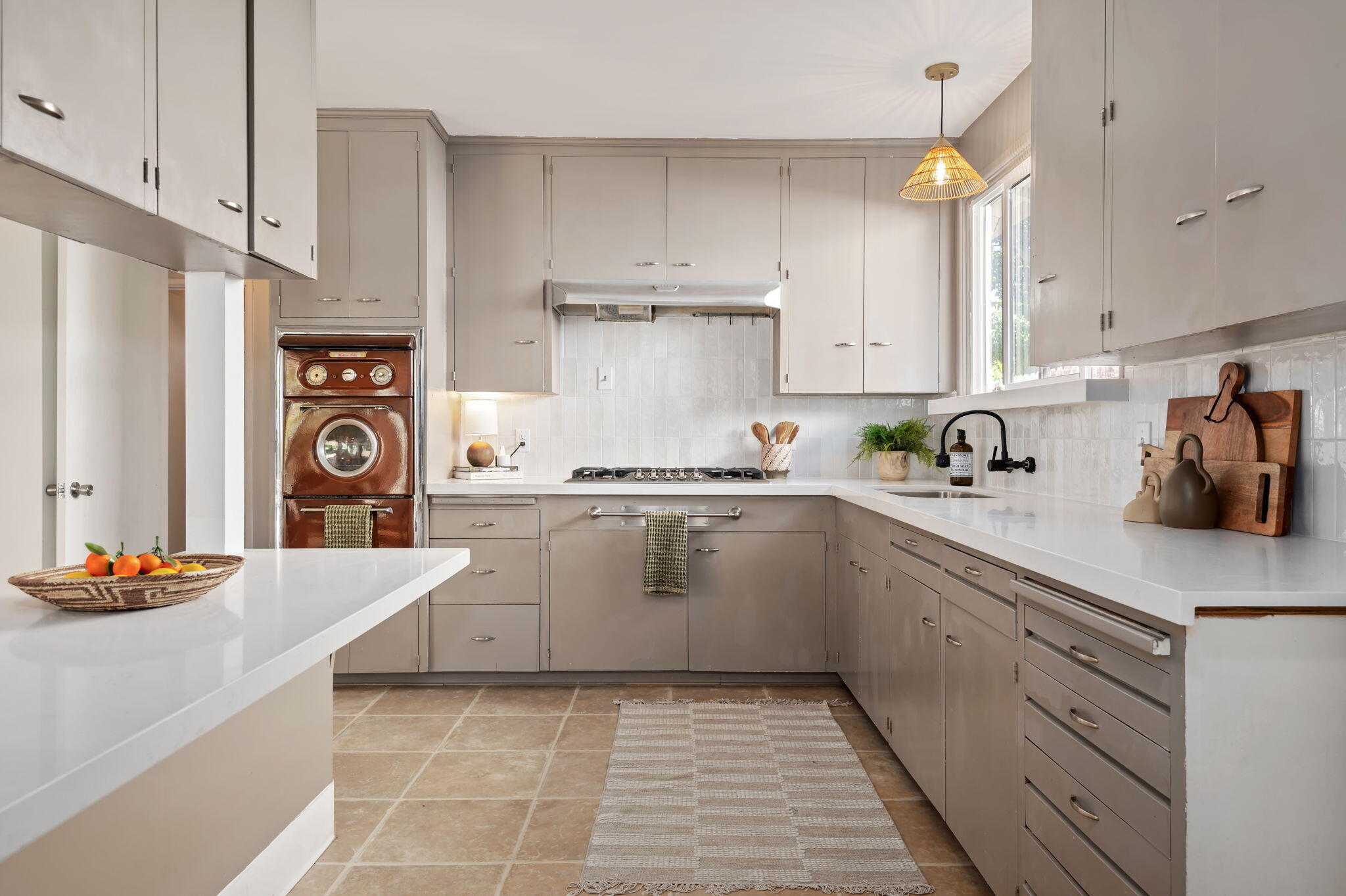 4612 Dean Drive Ventura, CA 93003 - Photo 9 of 33 a kitchen with a sink cabinets and window