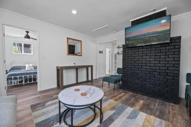 a view of a livingroom with furniture and wooden floor