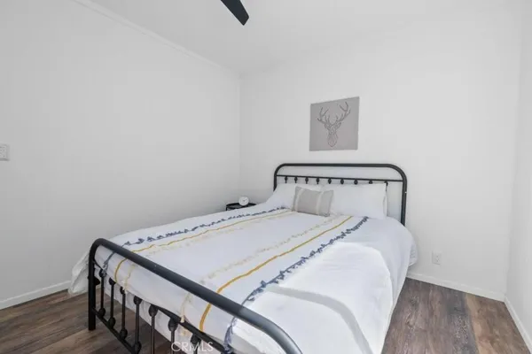 a bedroom with a bed and a table