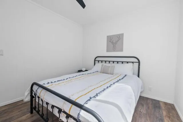 a bedroom with a bed and a table